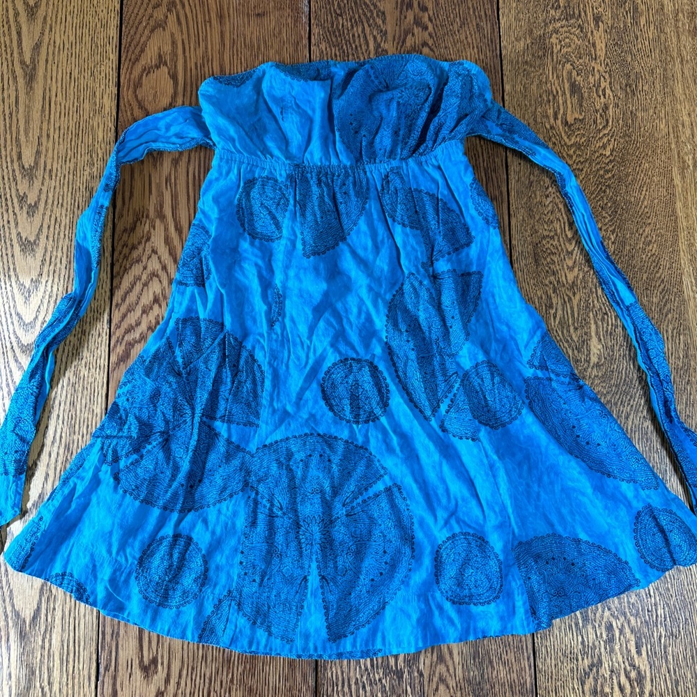 Vibrant Blue Strapless Dress with Intricate Patterns